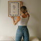 Cream print with a black dashed border featuring the handwritten quote 'how lucky are we' and a horseshoe illustration