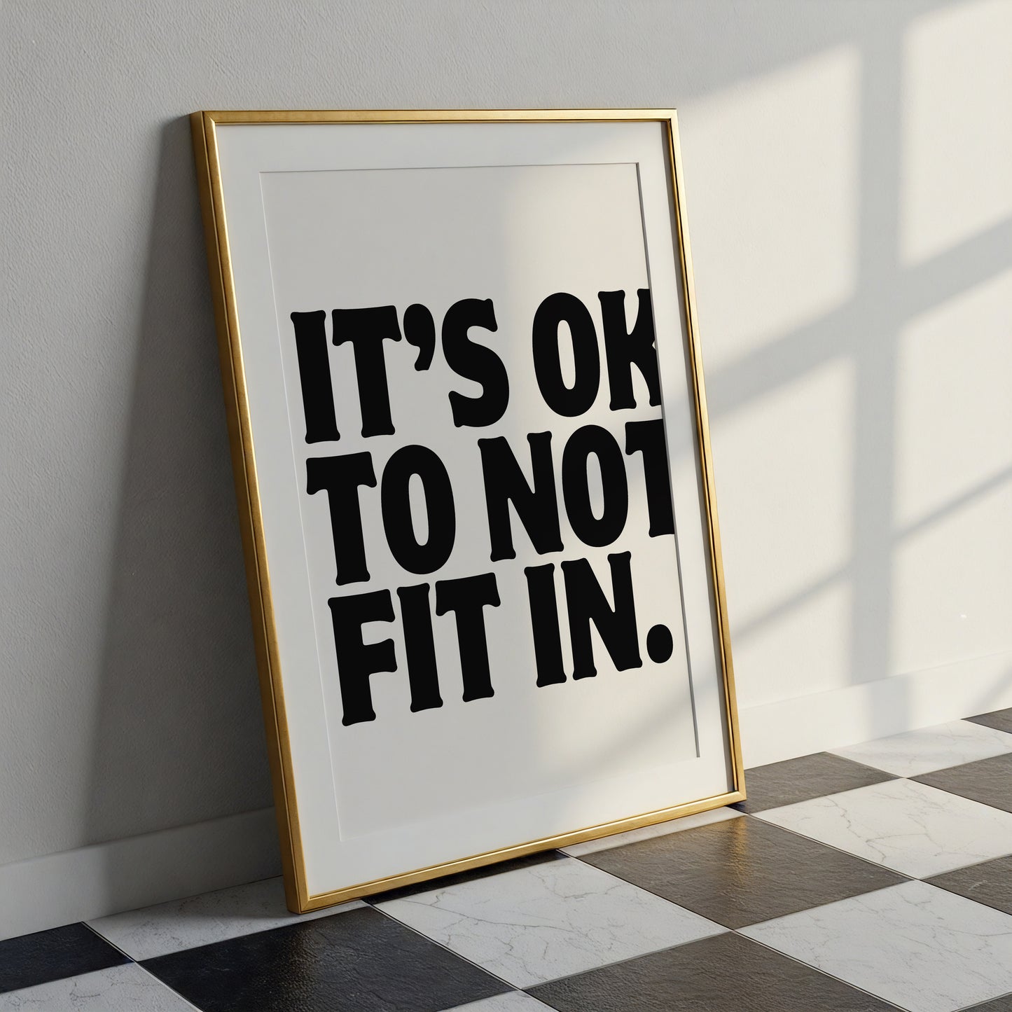Square cream wall print with bold oversized black chunky typography reading It's Ok To Not Fit In on a clean white background