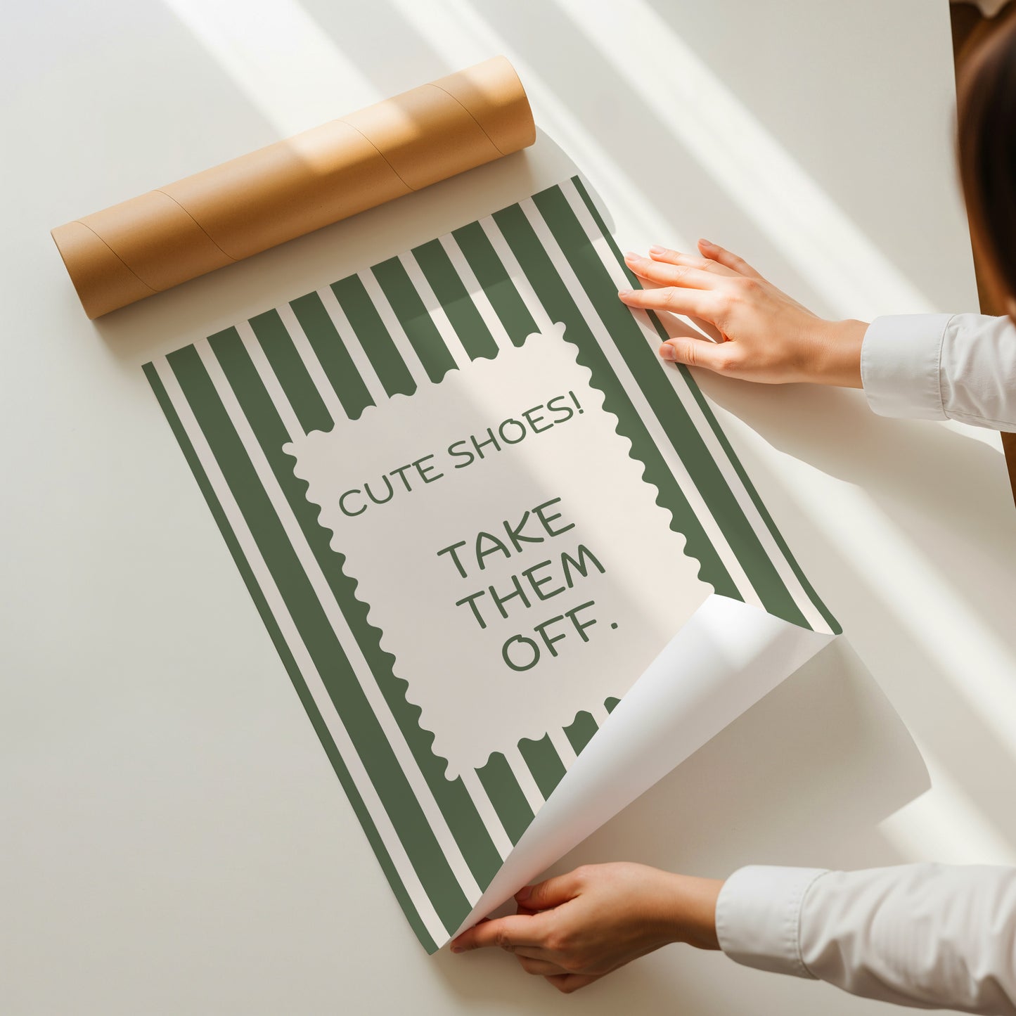 Vertical wall print with bold olive green and cream vertical stripes and a cream scalloped border text box reading Cute Shoes! Take Them Off. in matching green serif typography