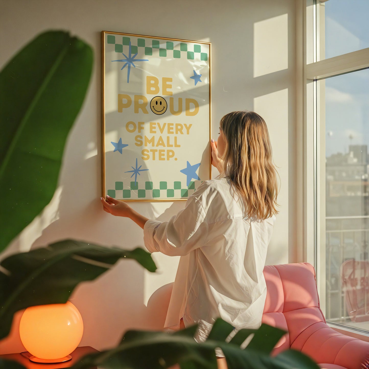 Cream print with a green checkered border, blue stars, and the phrase 'Be Proud of every small step' in yellow lettering with a smiley face replacing the O in Proud