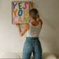 Vertical print with the words "YES YOU CAN" in large multicolored bubble letters — blue, green, pink, orange, yellow, and olive — on a white background.