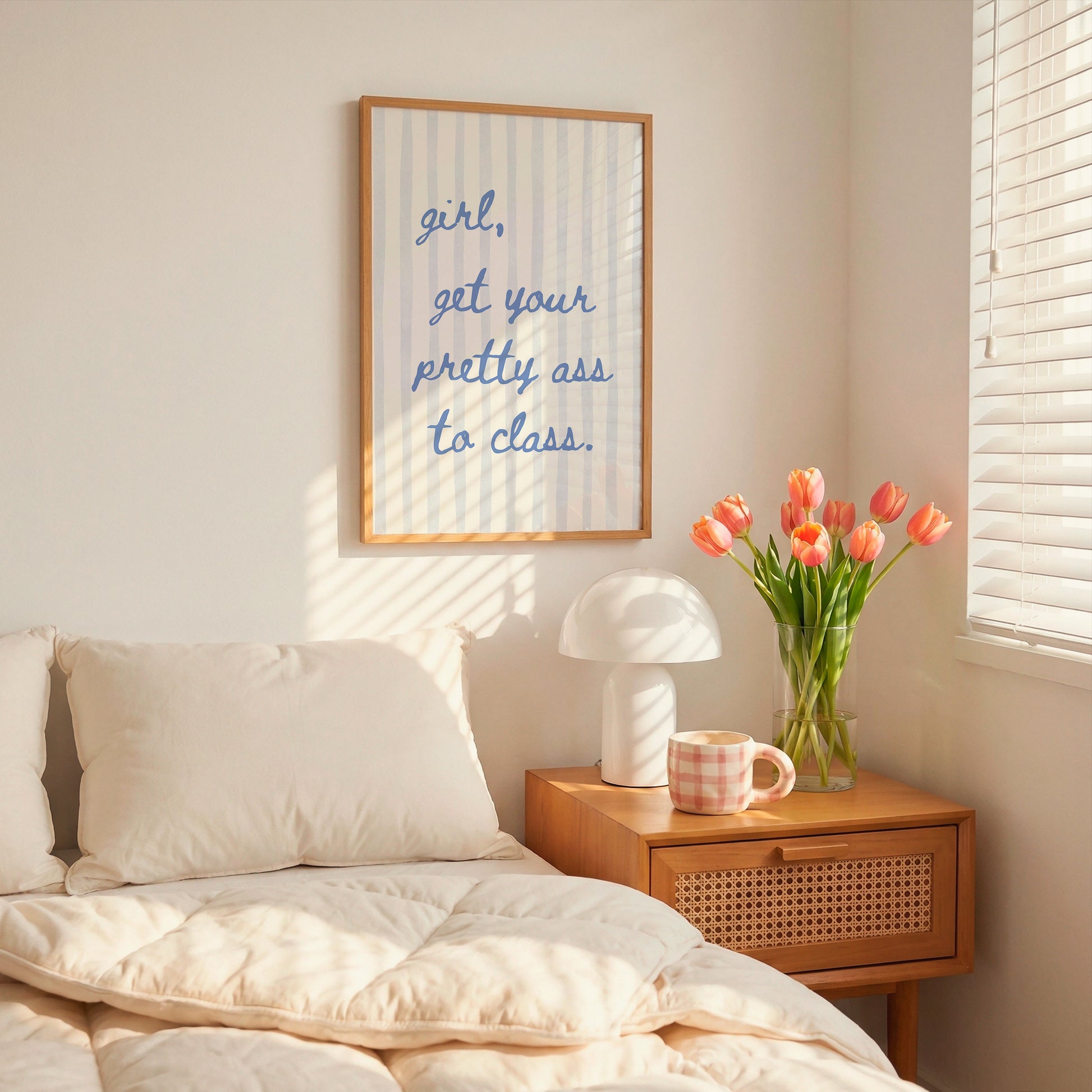 Vertical print with the handwritten cursive quote "girl, get your pretty ass to class." in blue script on a cream background with soft hand-painted pale blue vertical stripes.