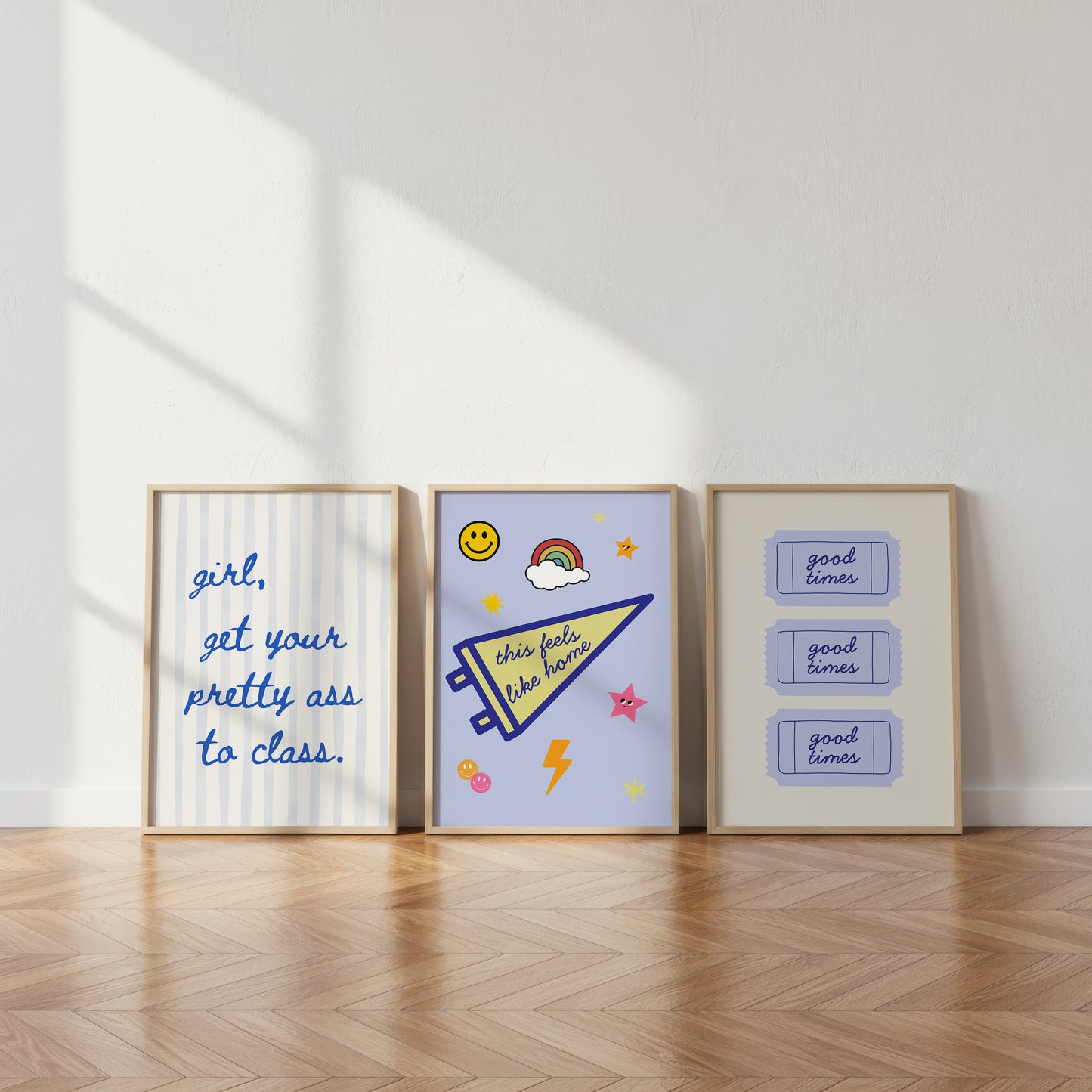 Set of 3 vertical preppy blue dorm room prints featuring a cursive stripe quote, a varsity pennant with stickers, and a retro good times ticket design