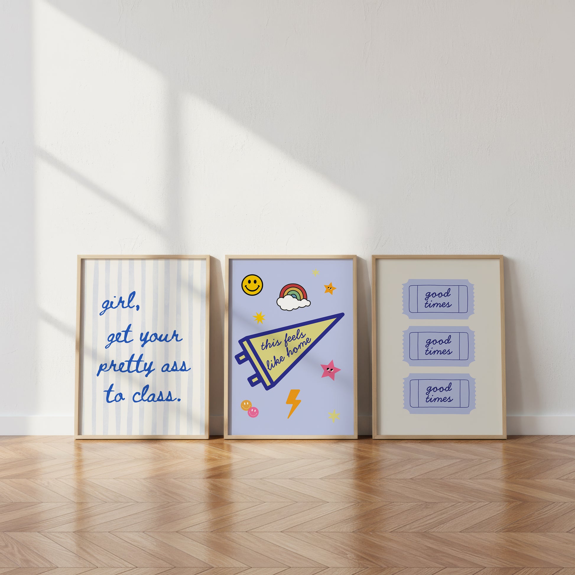 Set of 3 vertical preppy blue dorm room prints featuring a cursive stripe quote, a varsity pennant with stickers, and a retro good times ticket design