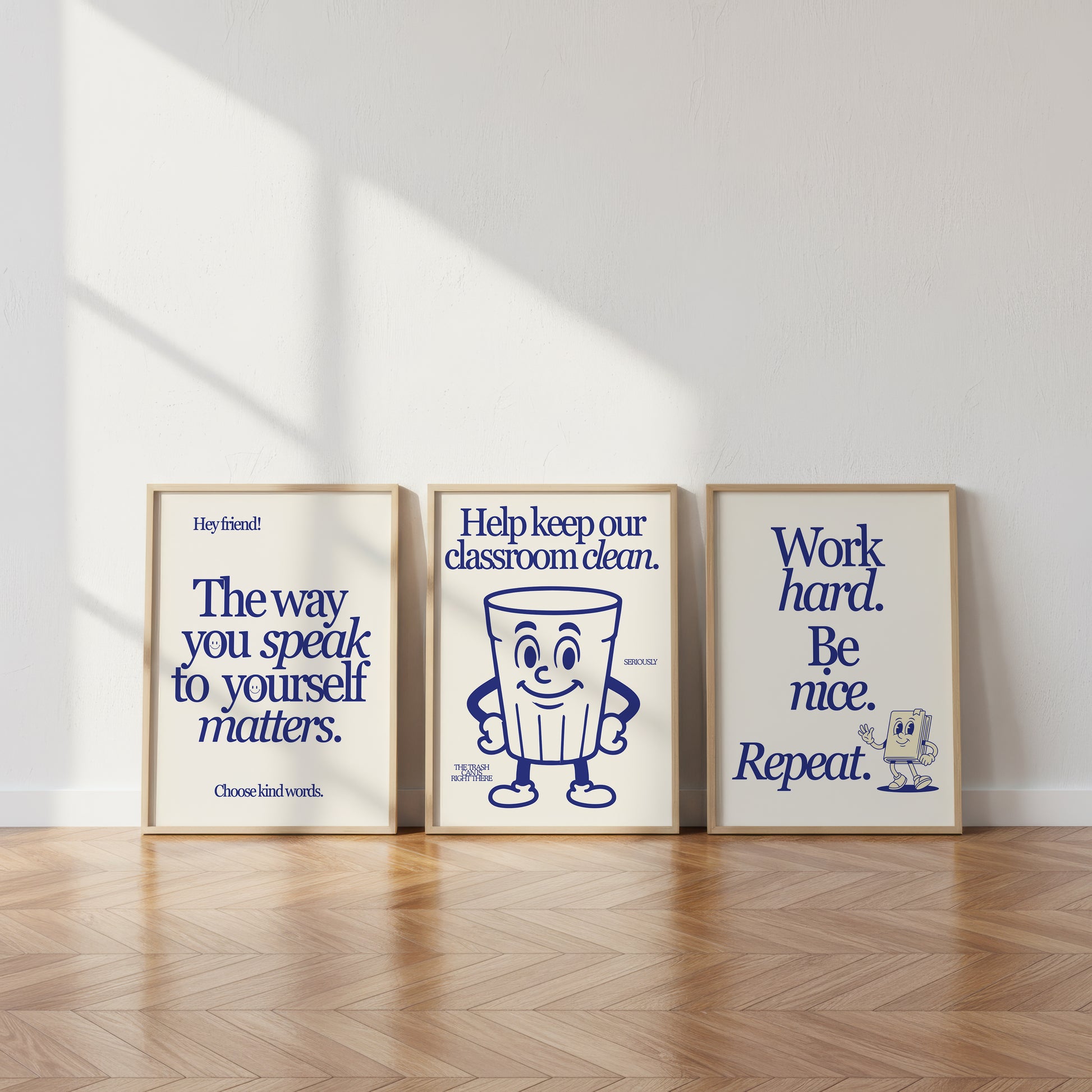 Set of 3 vertical navy and cream retro classroom prints with bold typography and character mascots including a trash can and walking book