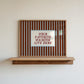 Horizontal striped art print reading 'Your Favorite Weirdos Live Here' as a welcome sign