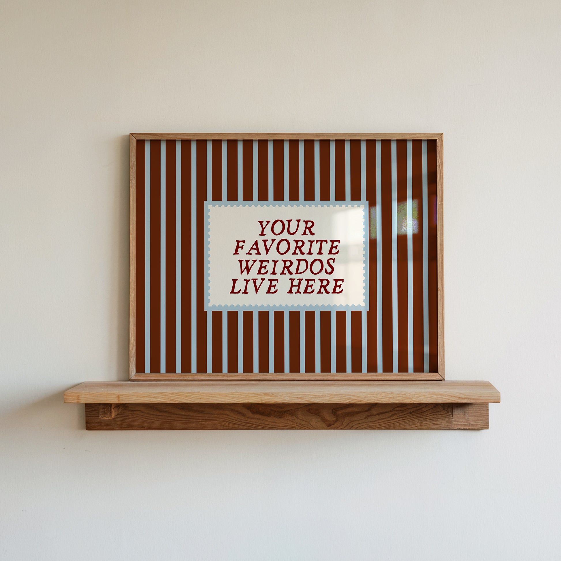 Horizontal striped art print reading 'Your Favorite Weirdos Live Here' as a welcome sign